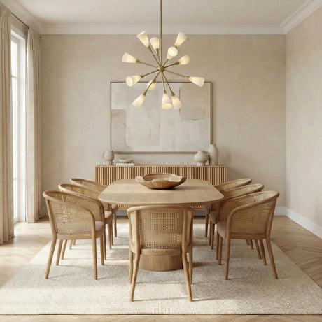 Aurora Chandelier 39", Brushed Brass geometric Chandelier in a Contemporary Dining Room with a light wood table and cane chairs.