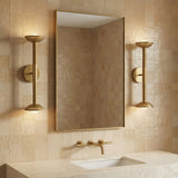 Brushed Brass linear 2-light wall sconce in a Contemporary Bathroom with a marble vanity.