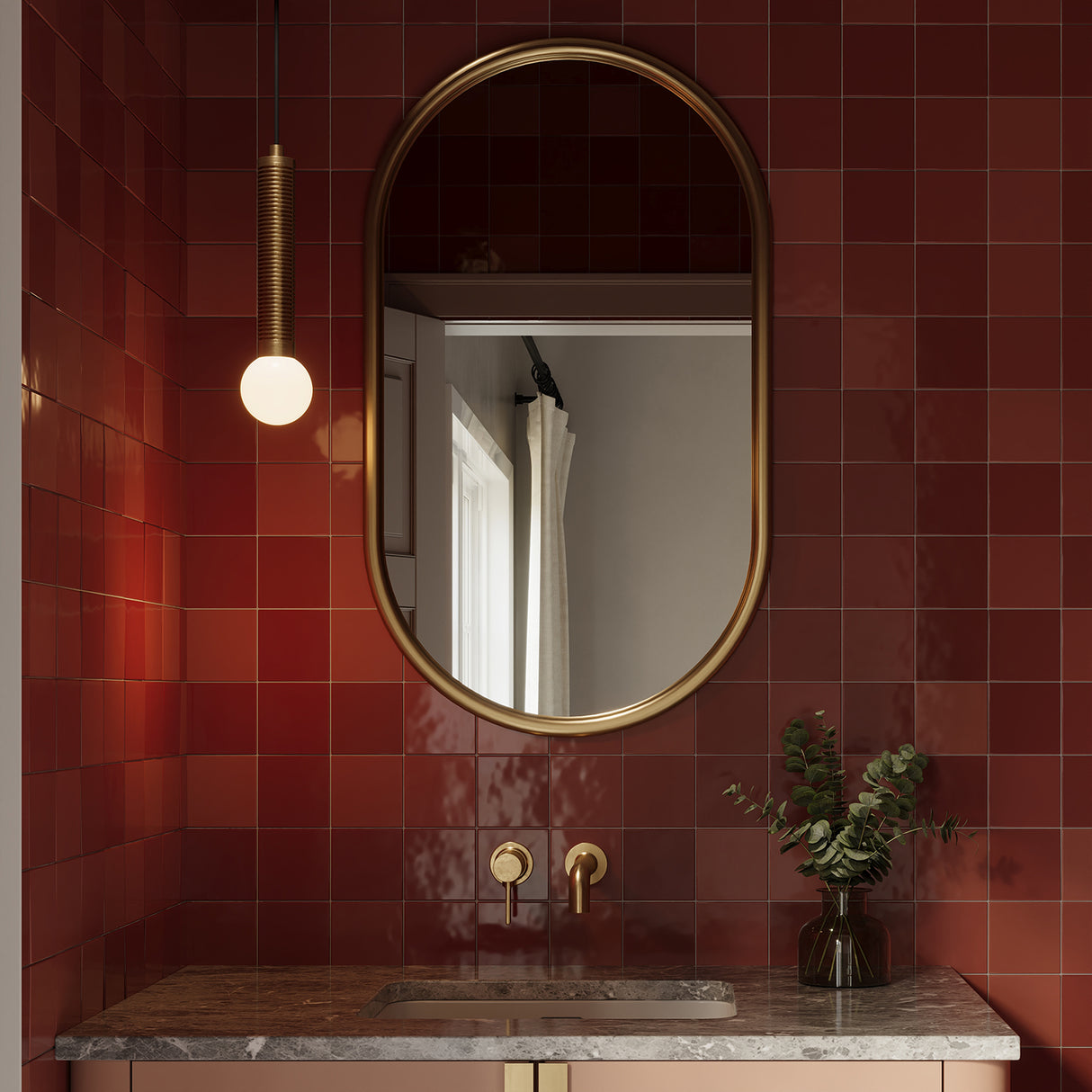 Shiloh LED Pendant 9", Brushed Brass finish is shown in a powder room with vibrant red tiles and an oval brass mirror.