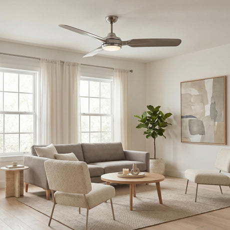 A modern living room with a Hobbs LED Ceiling Fan 60" in brushed nickel centered on the ceiling above a gray sofa and wood coffee table.