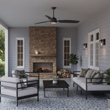 Hobbs 60" ceiling fan in matte black, shown in an outdoor living room with cool grey walls and a pattern tied floor. Two Orson Outdoor Wall Lights are flanking a white window on the back wall.