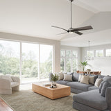 Modern living room with gray sofa, wooden coffee table, and large windows, featuring the Largo LED Ceiling Fan 56", in Brushed Nickel.