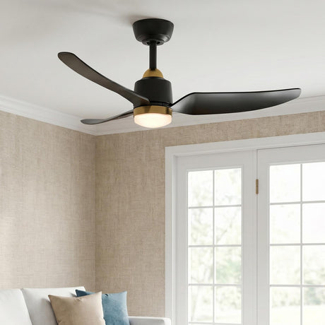 A transitional porch with the Kent LED Outdoor Ceiling Fan in brushed brass and matte black glowing at dusk on a white ceiling above beige textured siding.