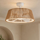 A coastal living room features the Elwood LED Ceiling Fan 24", White with Braided Rope mounted at the ceiling center against textured beige walls with an arched alcove.