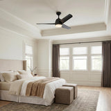 A transitional bedroom with a matte black Lorain LED Ceiling Fan 54" centered in a coffered ceiling above an upholstered bed and large windows with taupe curtains.