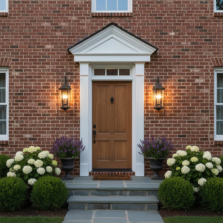 Asbury Outdoor Wall Light, Medium 29" Oiled Bronze - A brick house with a brown wooden door and two outdoor wall lights