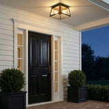 Alden Outdoor Flush Mount, Oiled Bronze geometric flush mount in a Traditional Outdoor entryway with a black door and boxwood planters.