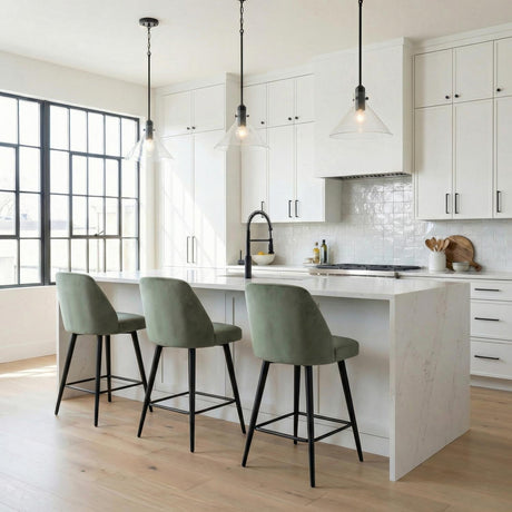 Nash Pendant 14”, Matte Black geometric Pendant in a Modern Kitchen with a white marble island and green velvet stools.