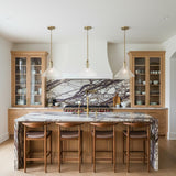 Nash Pendant 14”, Aged Brass geometric pendant lights in a Transitional Kitchen with a purple marble island.