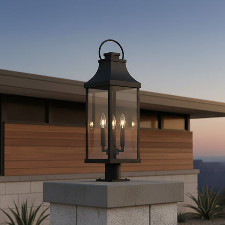 Ainsley Outdoor Post Light, Black - Black post light on a stone pillar with a building in the background