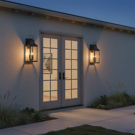Ainsley Outdoor Wall Light, Extra Large 27" Oiled Bronze - Two bronze outdoor wall lights flanking a set of glass-paneled doors
