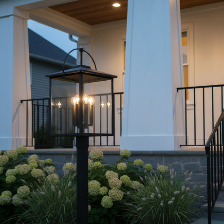 Darby Outdoor Post Light, Black - Black post light in front of a white porch with hydrangeas.