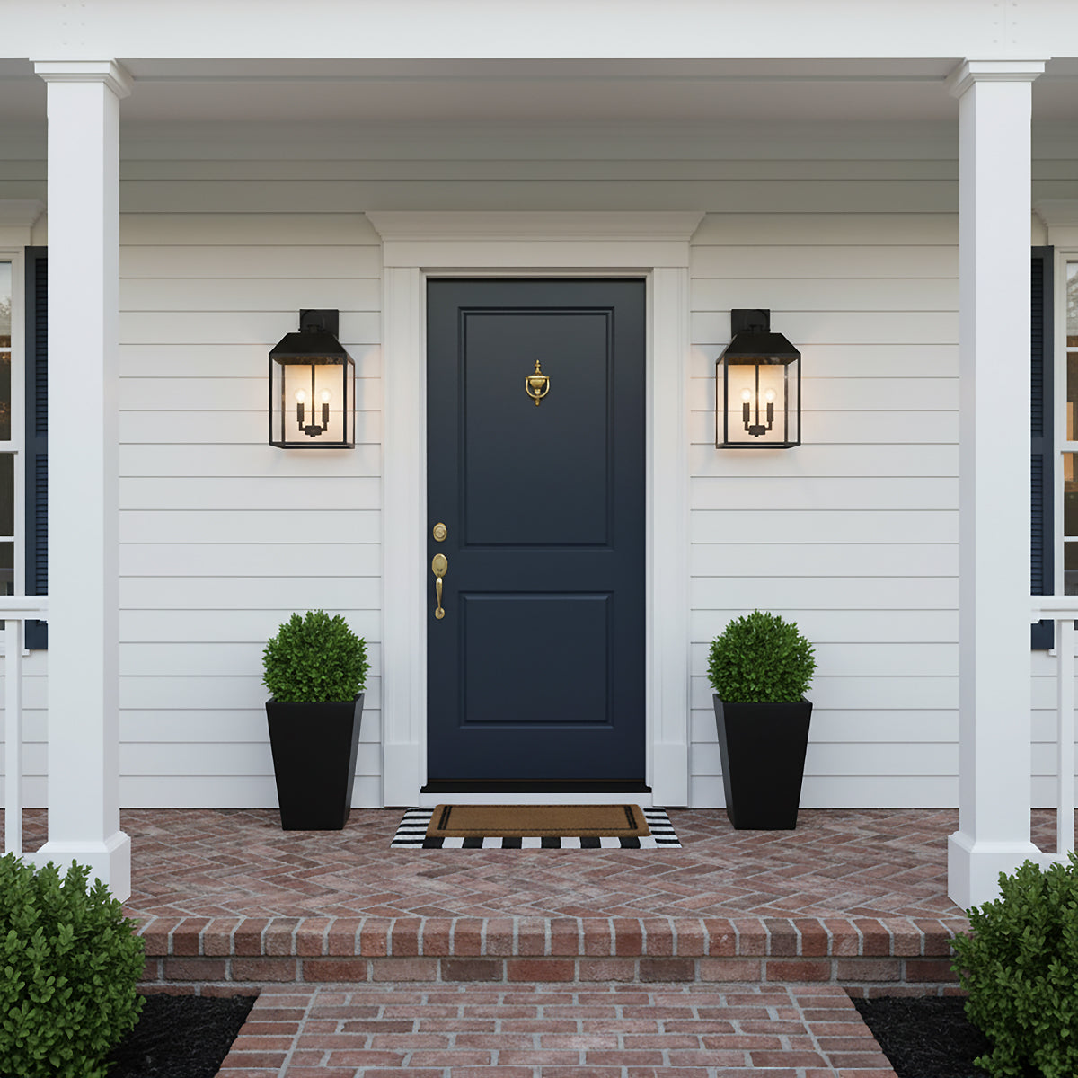 Porter Outdoor Wall Light, Medium 19" Black - Two black outdoor lanterns flanking a navy blue door