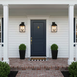 Porter Outdoor Wall Light, Medium 19" Black - Two black outdoor lanterns flanking a navy blue door