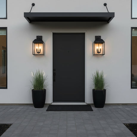 Porter Outdoor Wall Light, Medium 19" Black - Front view of a black door with two sconces on either side.