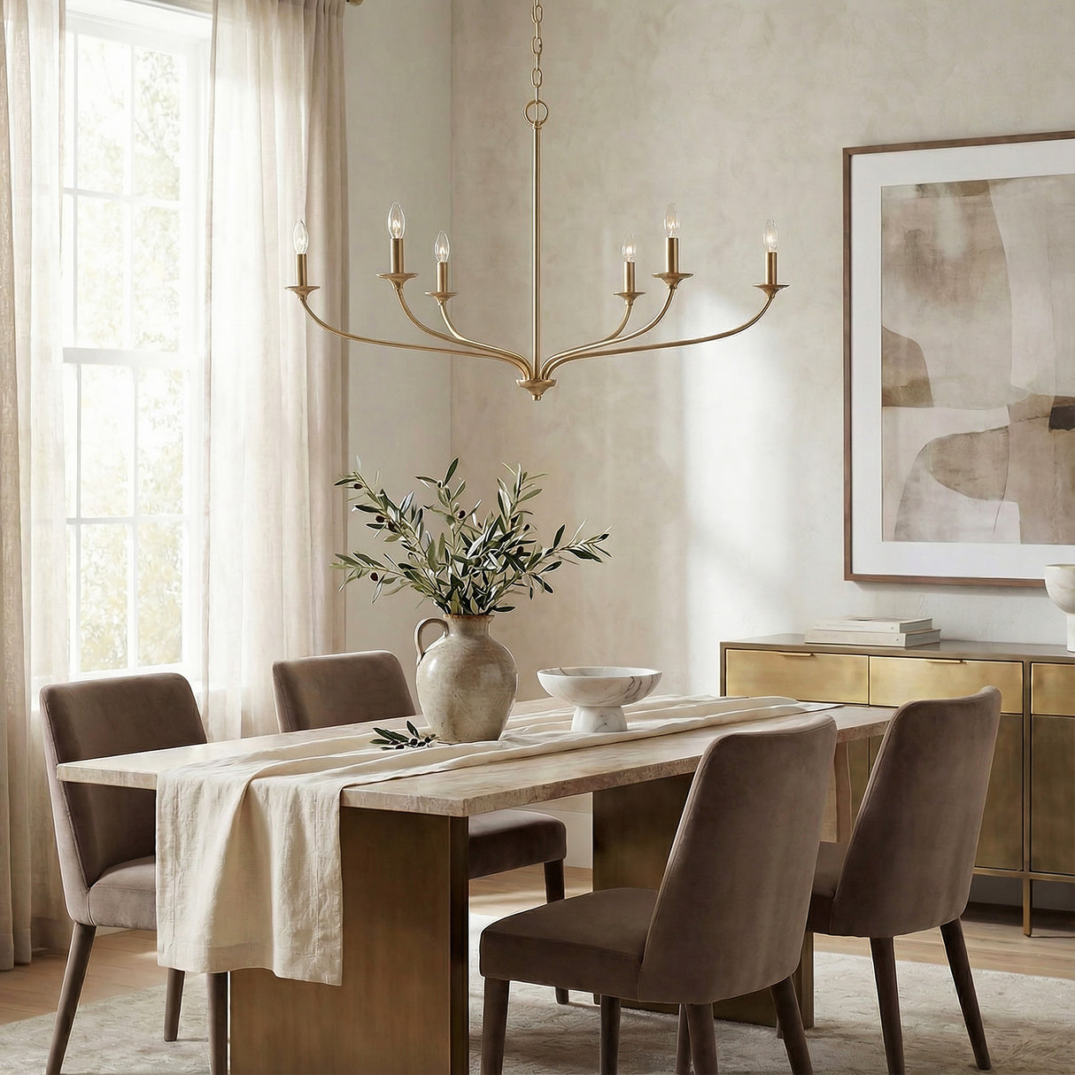 Oriana 6 Light Chandelier 40", Matte Brass linear Chandelier in a Transitional Dining Room with a marble dining table and velvet chairs.
