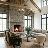 Oriana 6 Light Chandelier 40", Matte Black linear chandelier in a Modern Farmhouse Living Room with a stone fireplace.