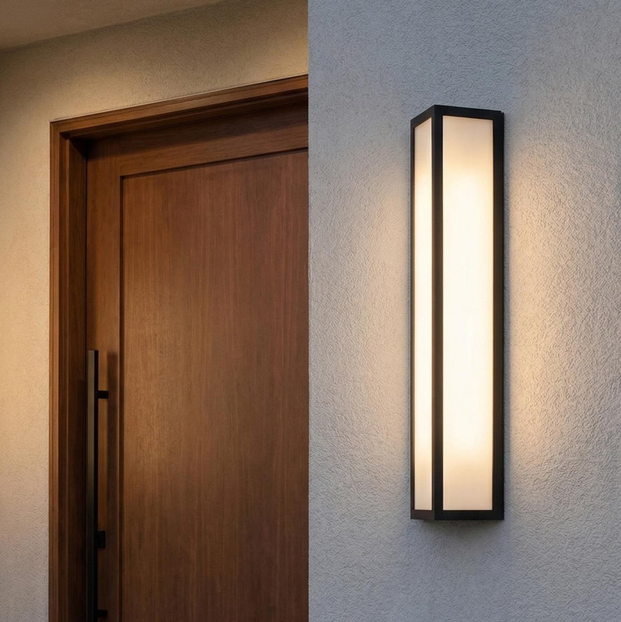 Ellis LED Outdoor Wall Light, Large 29" Black geometric Outdoor Wall in a Modern Outdoor entryway with a dark wood front door.