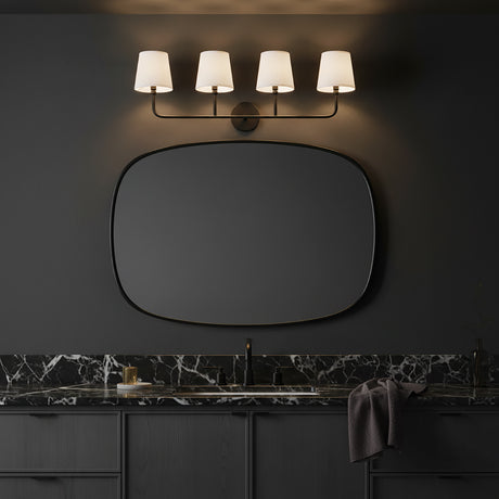 Moody dark grey bathroom vanity with the Elowen 4 Light fixture, in Matte Black, above an oval shaped mirror and black stone countertops.