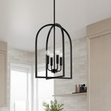 Elira Lantern Pendant in Matte Black hanging in a modern kitchen with cream tiled walls and light wooden cabinets.