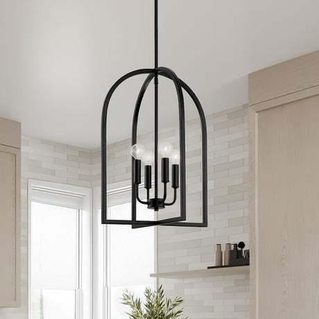 Elira Lantern Pendant in Matte Black hanging in a modern kitchen with cream tiled walls and light wooden cabinets.
