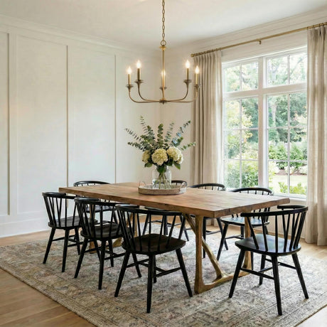 Harper 5 Light Chandelier 31", Aged Brass geometric Chandelier in a Transitional Dining Room with a rustic oak table and black chairs.