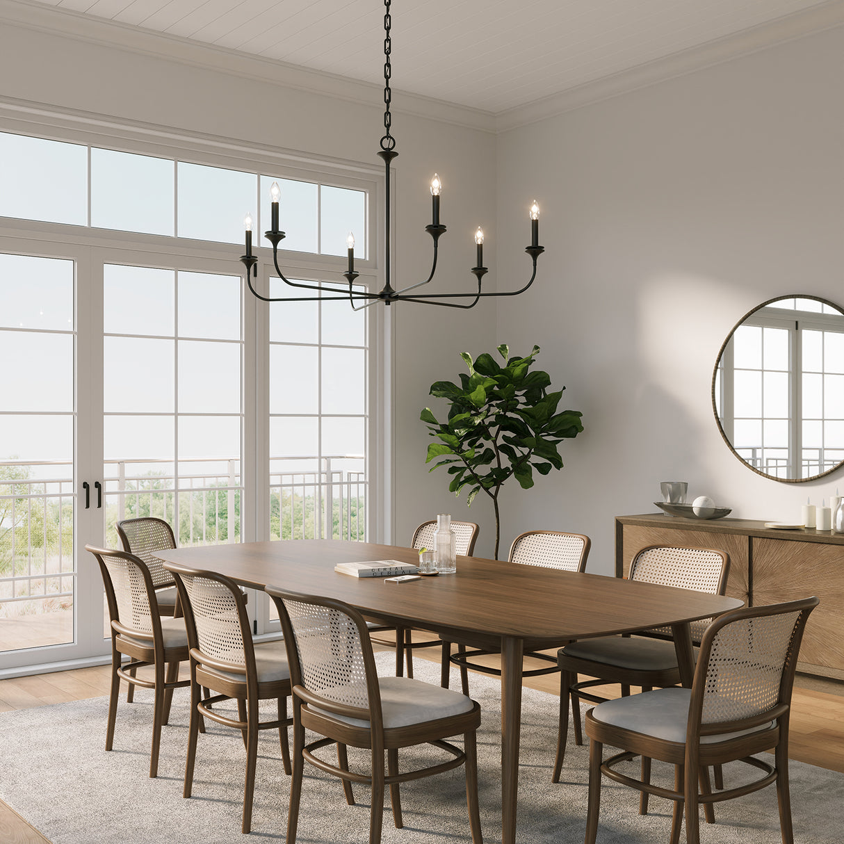 Harper 6 Light 49" wide Chandelier in Matte Black hung above a long wooden dining table with seating for eight.