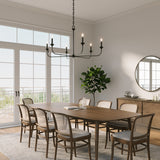 Harper 6 Light 49" wide Chandelier in Matte Black hung above a long wooden dining table with seating for eight.