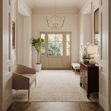 Eloise 28" Pendant in brass is shown in a grand, bright foyer with chantilly lace painted walls and traditional furnishings.