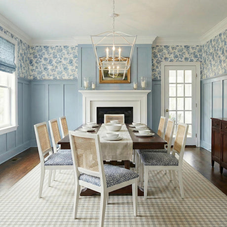 Eloise Lantern Pendant 28", Textured White geometric Pendant in a Coastal Dining Room with cane back chairs and blue floral wallpaper.