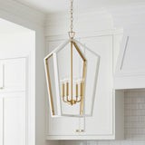 A transitional kitchen features the Talin Lantern Pendant 20 inch White and Matte Brass hanging in the ceiling center before white shaker cabinets and a subway tile backsplash.
