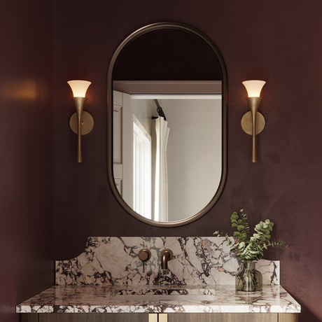 Deep burgundy powder room with marble countertops and two Fleur Wall Sconces  in Textured Brushed Brass finish on either side of the mirror