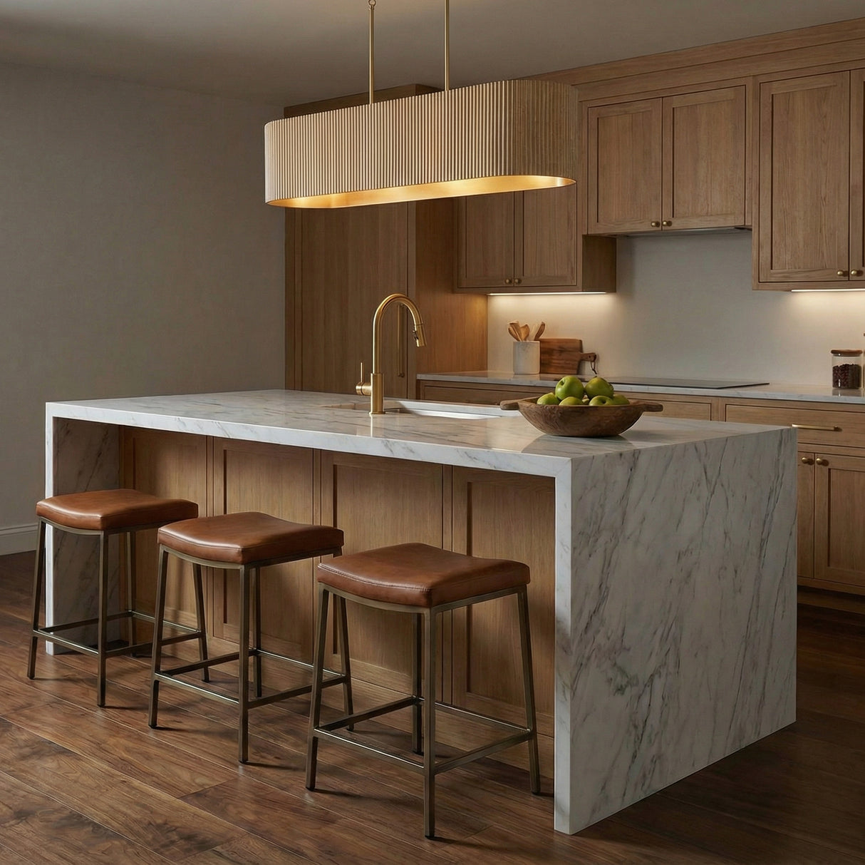 Leery Linear Pendant 44", Whitewash and Matte Brass linear pendant in a Transitional Kitchen with a white marble island.