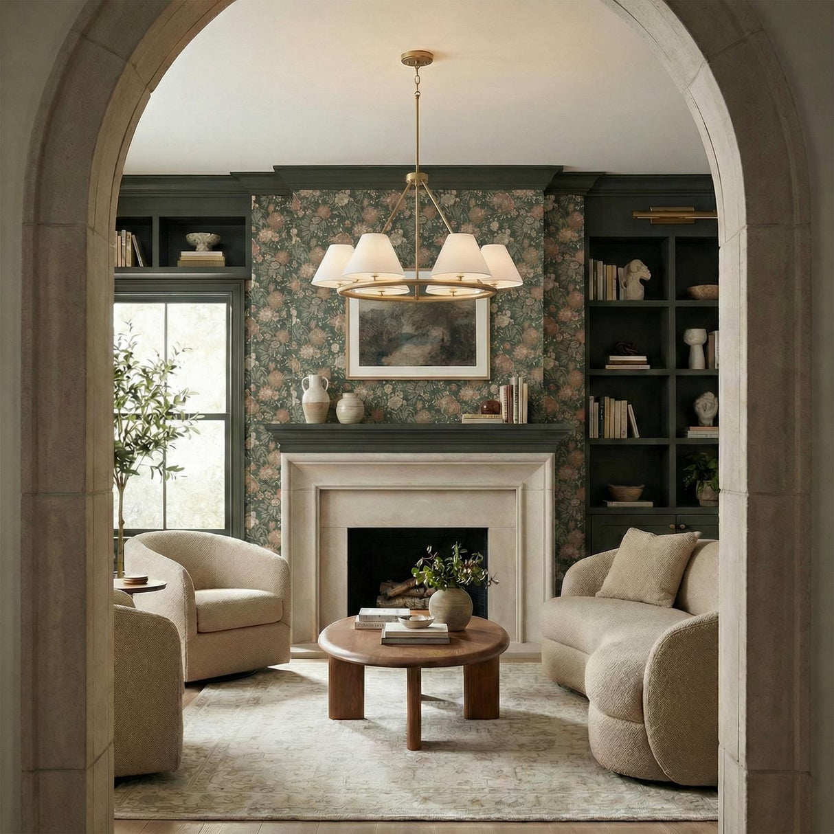 Simone 6 Light Ring Chandelier 35", Matte Brass geometric Chandelier in a Traditional Living Room with floral wallpaper and curved sofa.