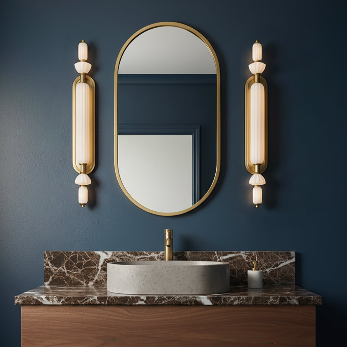 Giselle LED Vanity 31, Brass with Opal Glass - Vanity with brass fixtures and mirror on a blue wall