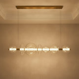Elara LED 7 Light Linear Chandelier 56", Brass and Clear Glass for Modern home with Textured Beige Walls