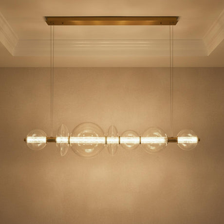 Elara LED 7 Light Linear Chandelier 56", Brass and Clear Glass for Modern home with Textured Beige Walls