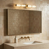 Elara LED 4 Light Vanity 30", Brass and Clear Glass for Modern home with Beige Tile