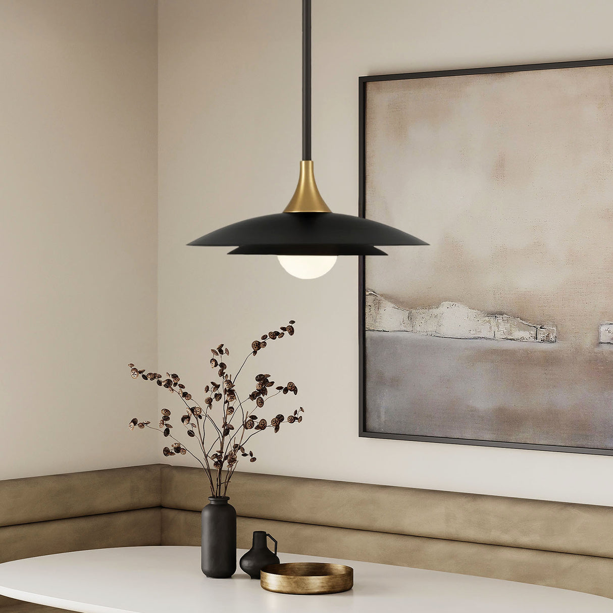 Yates modern pendant light 18" wide in black and brass in a modern dining nook.