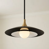Matte Black and Brass geometric pendant in a Modern Dining Room with neutral walls and crown molding.