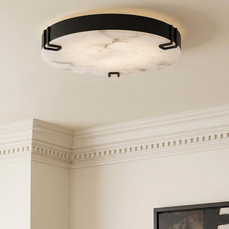 A traditional entryway featuring a matte black and alabaster flush mount installed along the ceiling with ornate dentil crown molding and a framed canvas art.