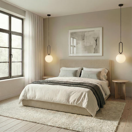 Oren Matte Black and Opal Glass globe geometric pendant in a Contemporary Bedroom with an upholstered beige bed and wooden side tables.