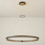 Brass and Black geometric Pendant in a Modern Living Room with clean walls and crown molding.