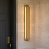 Rye LED Outdoor Wall Light 32",  Textured Gold finish, next to a front door.