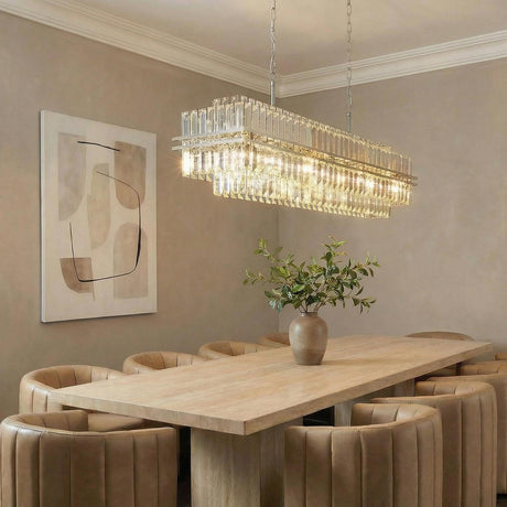 Maxwell 16 Light Linear Chandelier 50", Crystal with Polished Nickel linear Chandelier in a Contemporary Dining Room with tan chairs.