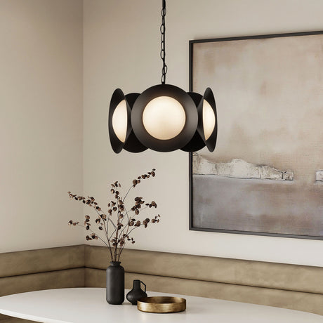 Elon modern pendant light fixture in a room with a painting and decorative items.
