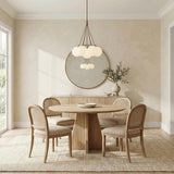 Soren Brass clustered globe design Chandelier in a Transitional Dining Room with a light oak table and cane back chairs.