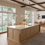 Modern kitchen with a large island and three Alverna 16" pendant lights, Matte White with Rattan Accents.