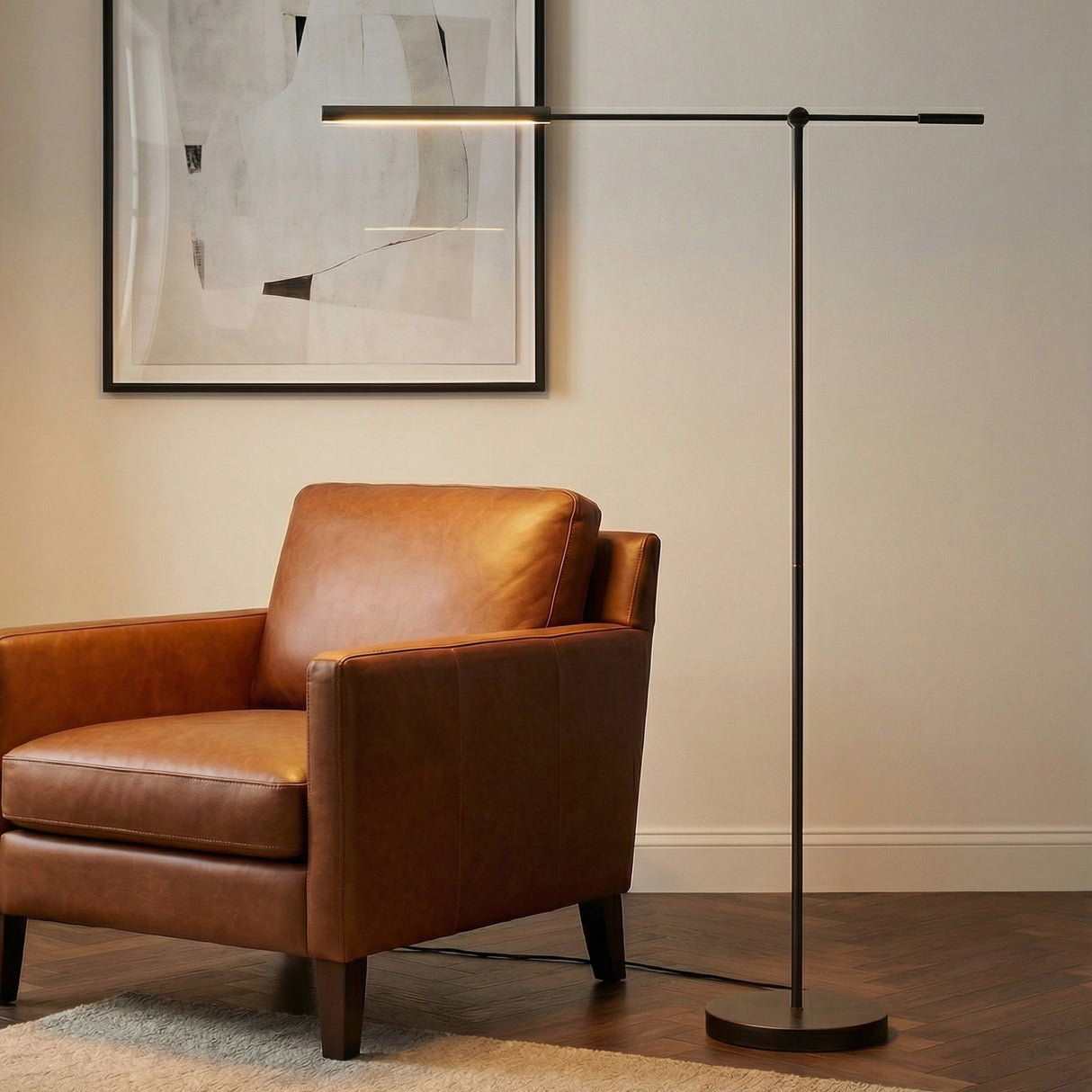 Linden LED Floor Lamp 55", Urban Bronze linear Floor Lamp in a Modern Living Room with a brown leather armchair.