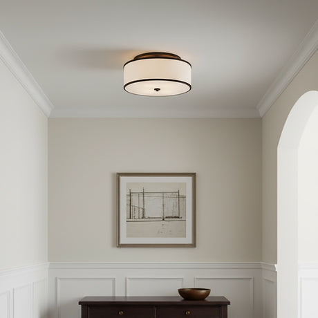 Walker Medium Flush Mount 20" Old Bronze - A drum-shaped flush mount light fixture with a white fabric shade and an old bronze trim is installed on a white ceiling.